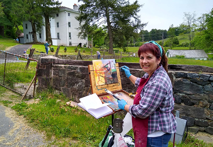 Woman painting at Keurner Farm.