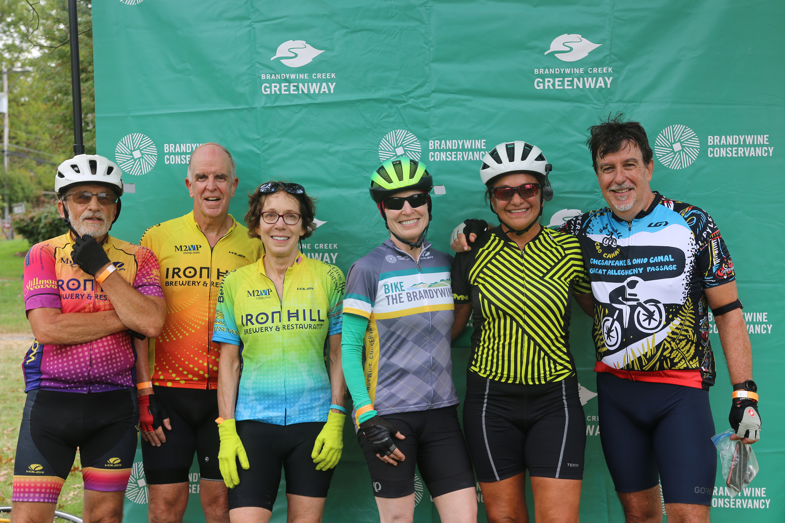 Six cyclists posing together after finishing the sixth Bike the Brandywine event