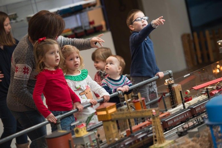 Excited kids pointing at the A Brandywine Christmas train display in Chadds Ford, PA