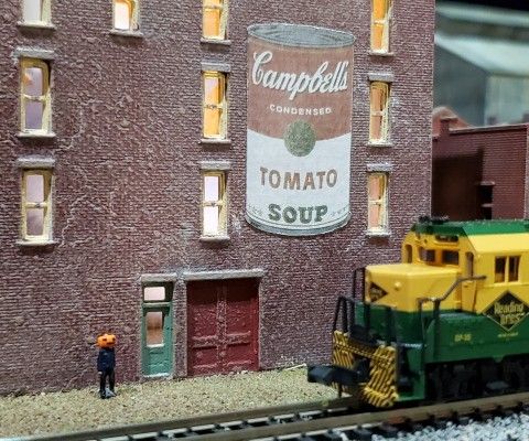 View of Jamie Wyeth's N-Gauge train display, featuring a miniature figurine depicting Wyeth's "Pumpkinhead" self-portrait