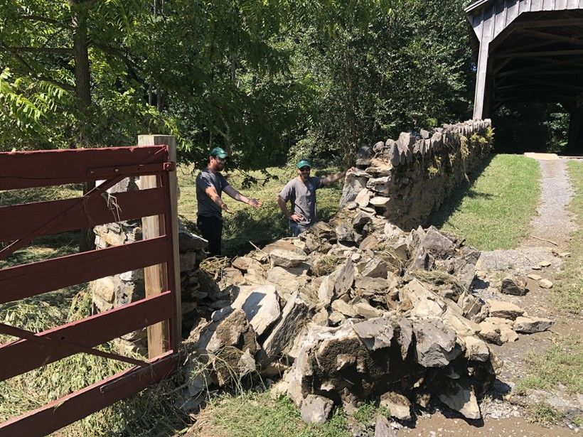 Damage to the stone apron leading up to the covered bridge at the Laurels Preserve