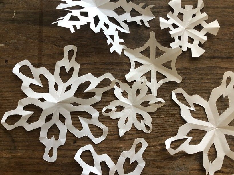 Hang different sized snowflakes with fishing line for a winter