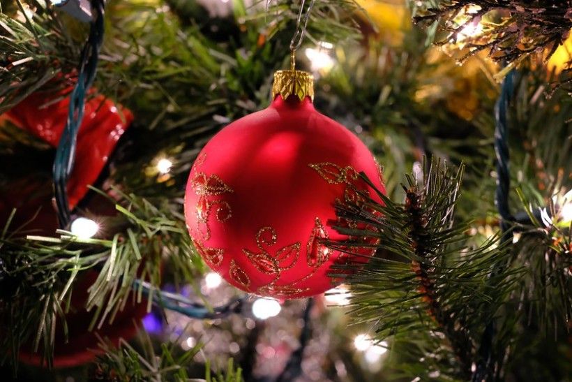 Photo credit: Gene Ellison, flickr Closeup shot of an artificial Christmas tree with a large red ornament in the center