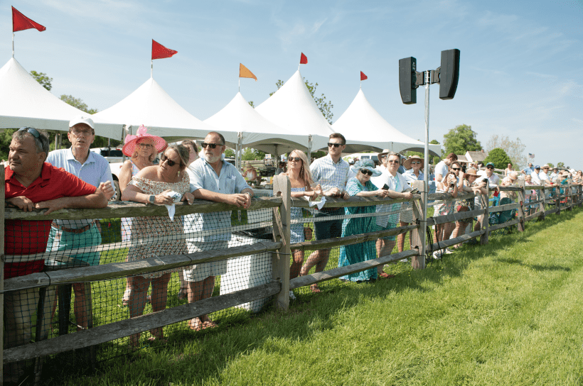 Crowd gathers on the home stretch to watch the Radnor Hunt Races.