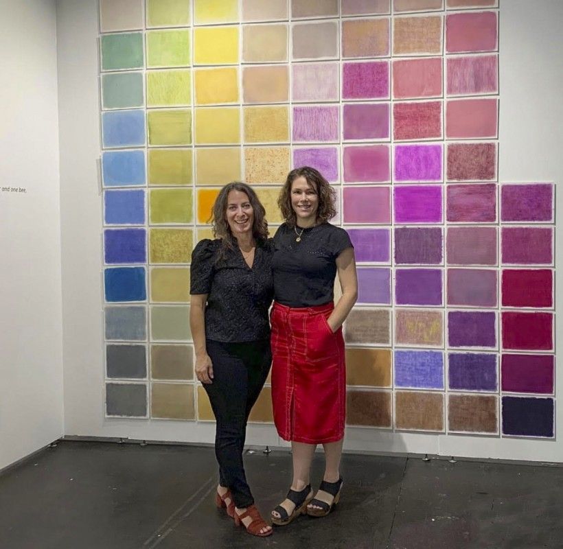 Photo of Leah Sobsey and Amanda Marchand, courtesy Rick Wester Fine Art, NYC Two women standing in front of artwork