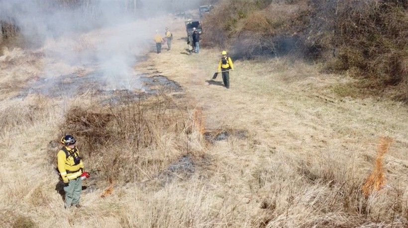 Burn crew making sure the fire goes out. Photo by Jim Moore.