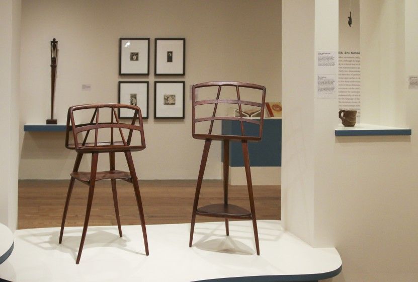 View inside of the "The Crafted World of Wharton Esherick" exhibition, featuring wooden furniture, sculptures, paintings, and prints.